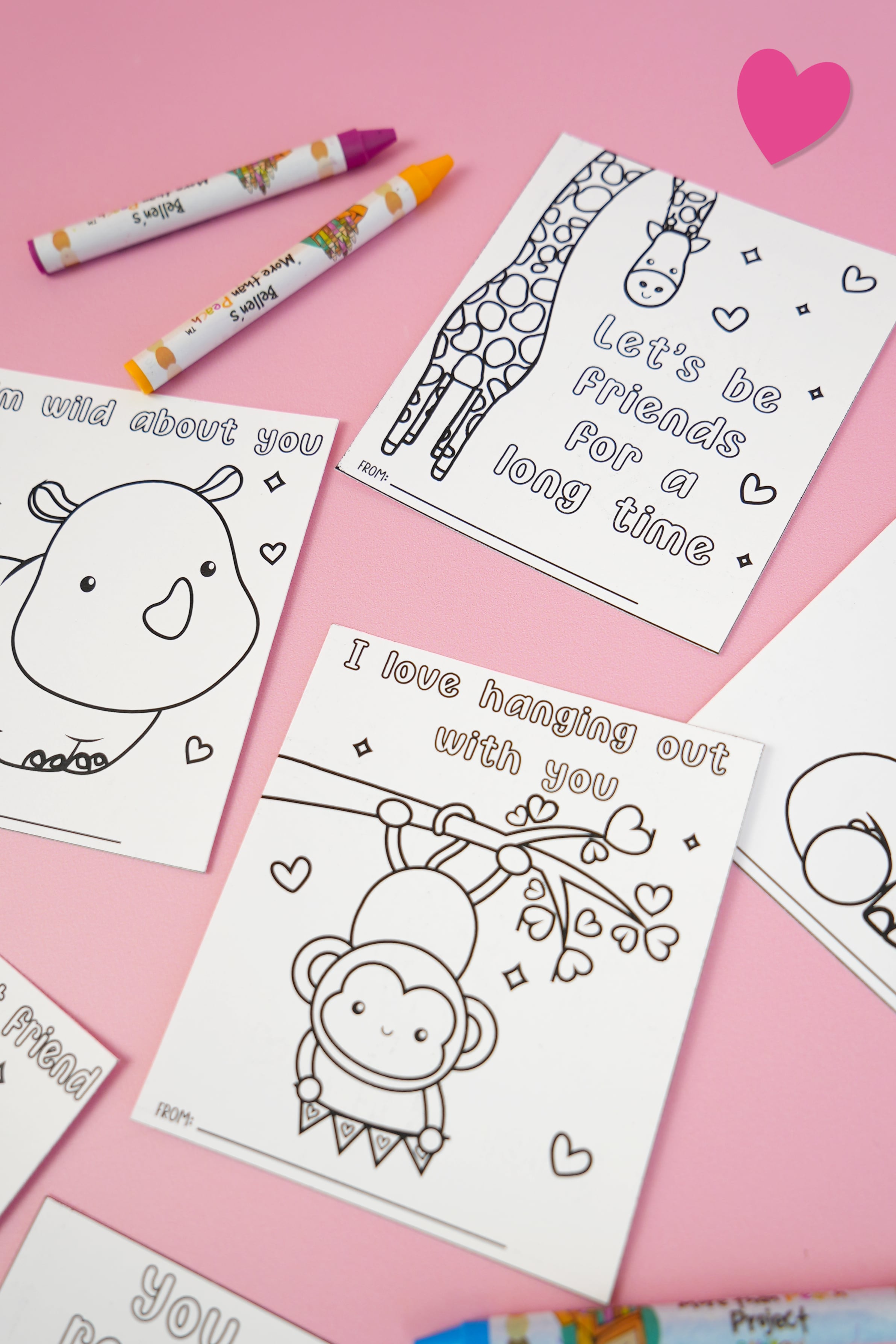 Printable Valentine's Day cards with jungle animals on light pink background with hearts and crayons