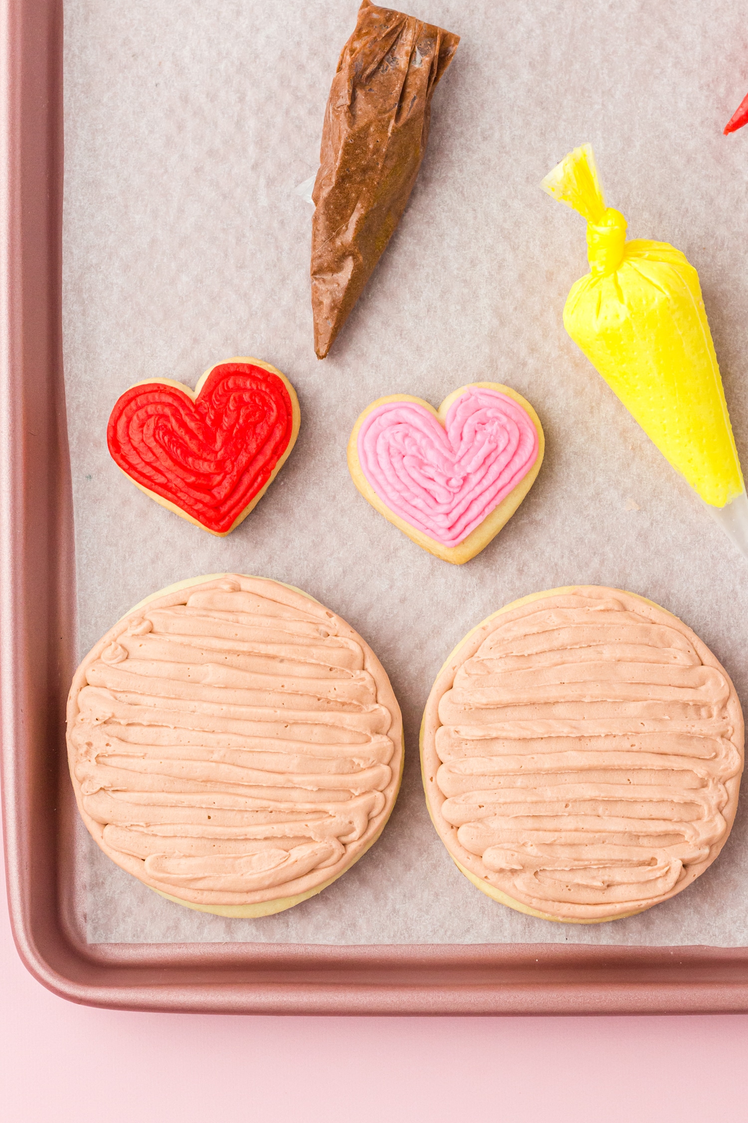 Up close image of icing sugar cookies on baking sheet