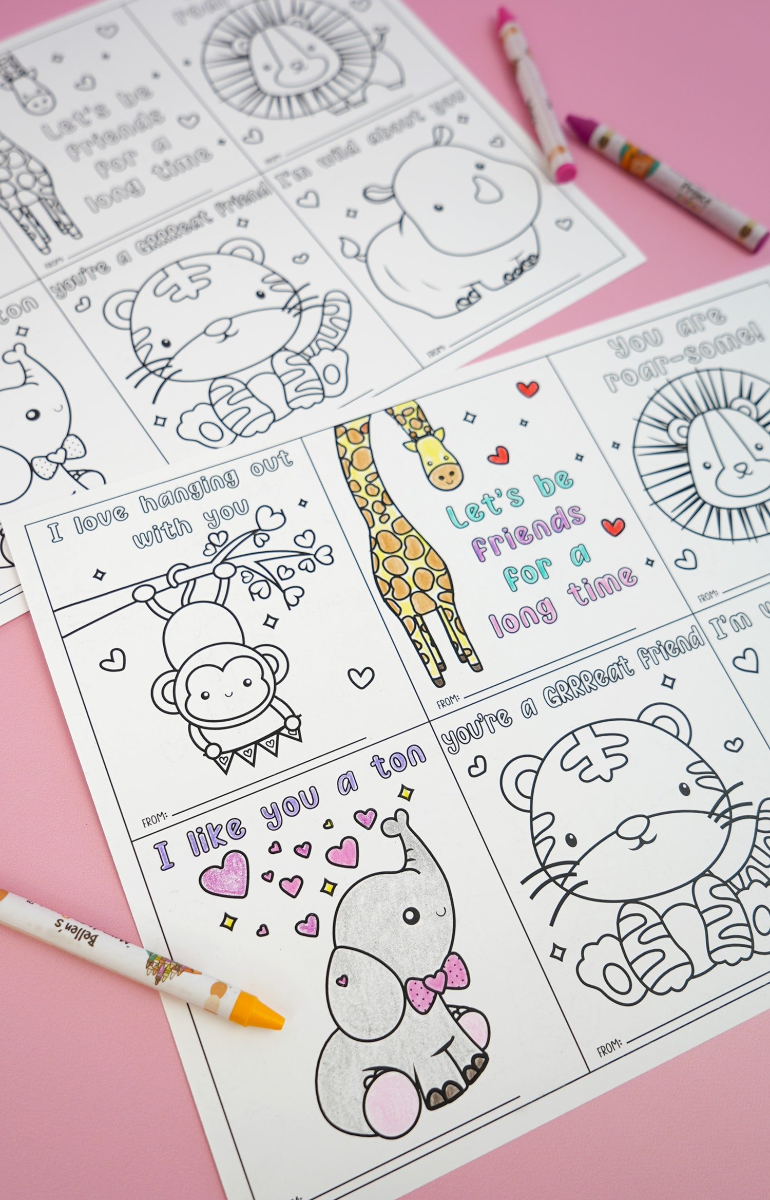Valentine coloring cards with jungle animals on pink background with crayons