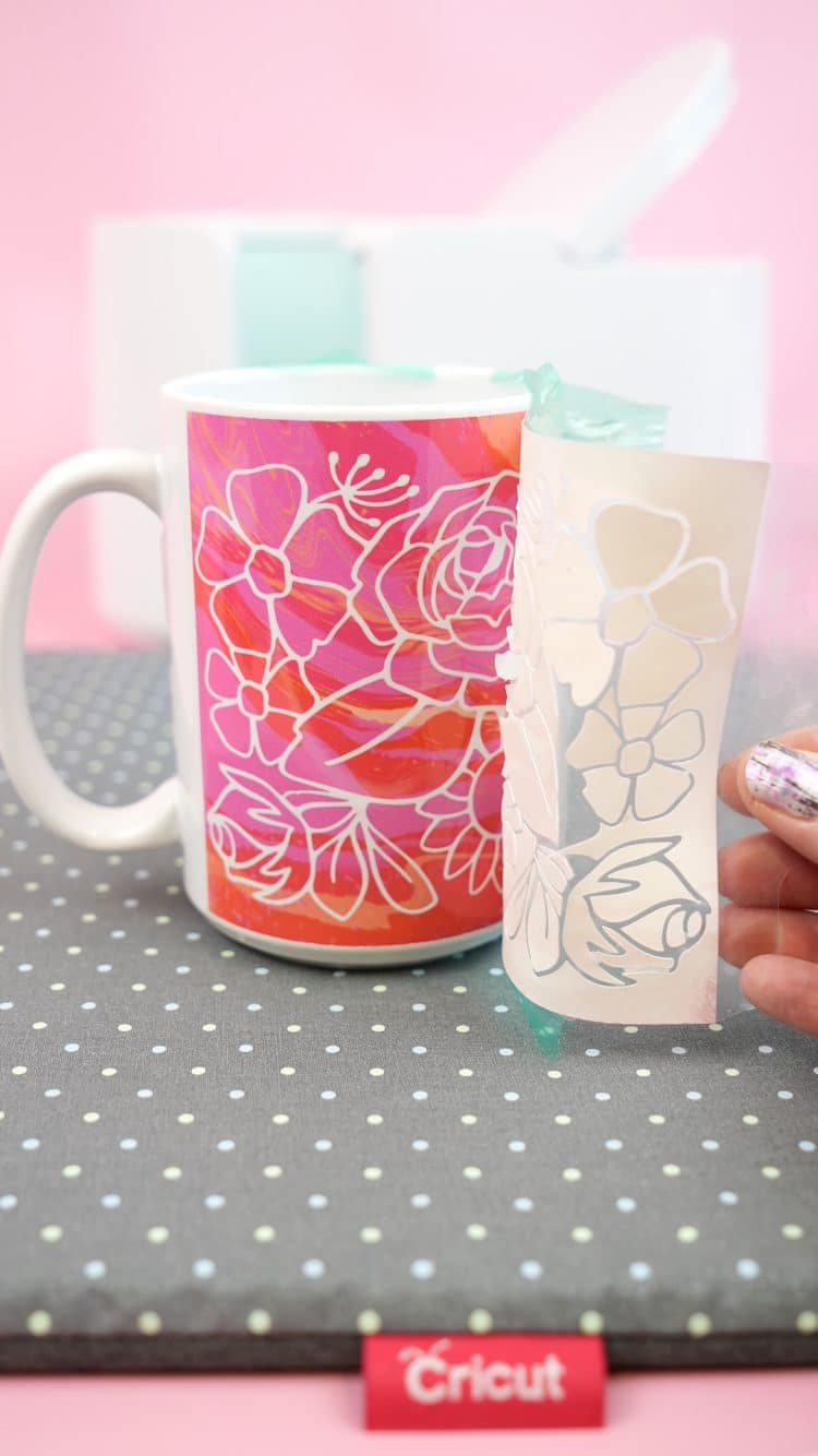 removing design from mug and revealing finished floral mug
