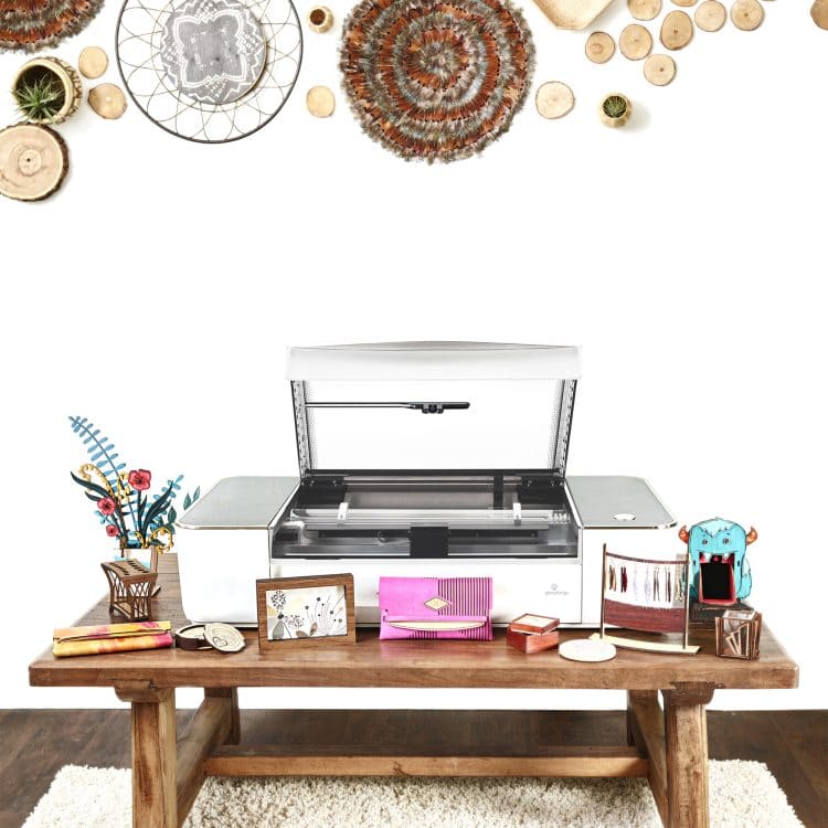 glowforge machine on wooden table with decorations