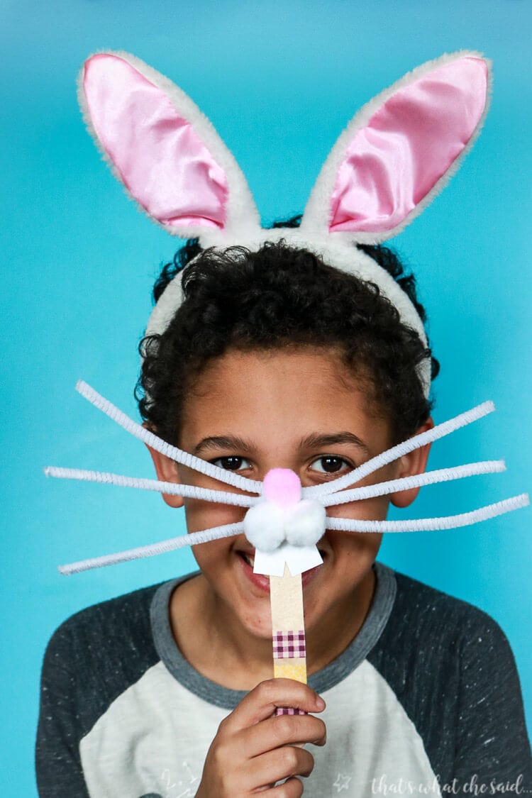 kid holding easter bunny face photo prop 