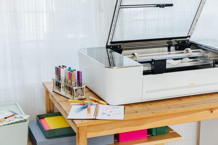 glowforge on table with craft supplies