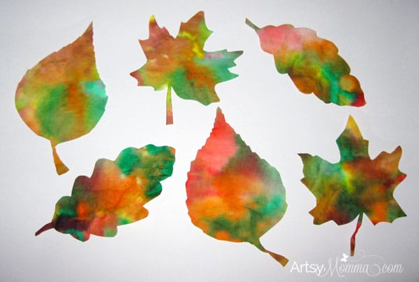 6 green, orange, brown, and red dyed coffee filters cut to look like fall leaves.