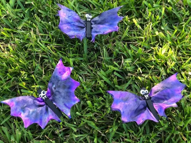 Purple dyed coffee filters cut into wing shape for bats.