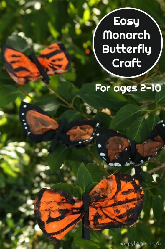 Orange and black dyed coffee filters pinched with a black clothespin to look like monarch butterflies.