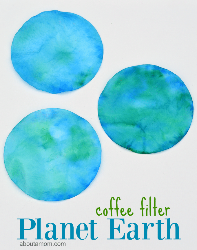 Blue and green dyed coffee filters in the shape of the earth.