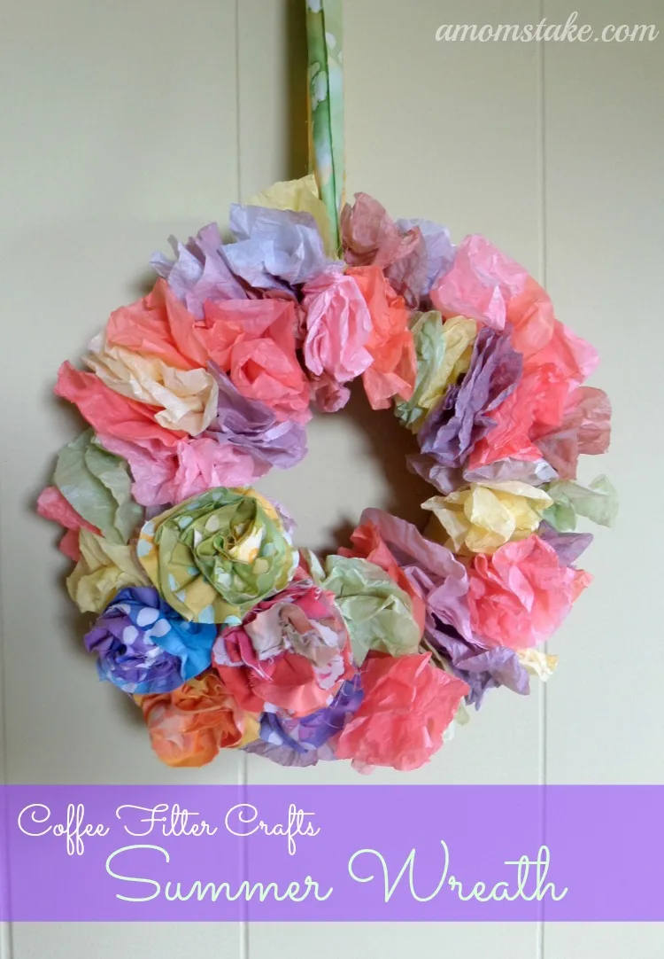 Purple, pink, yellow, and green dyed coffee filters arranged in a wreath.