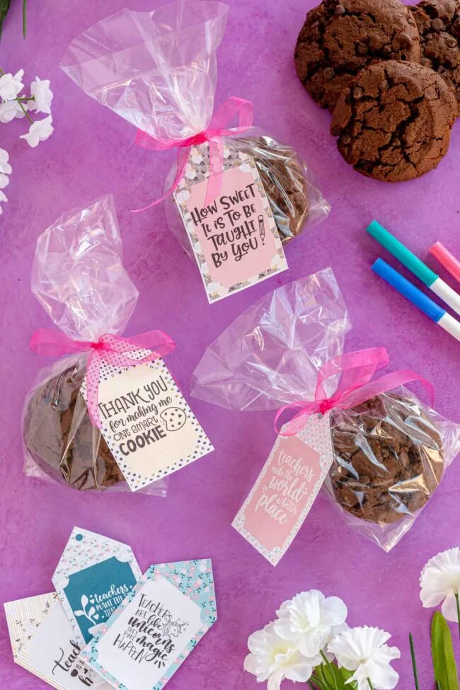 teacher appreciation gift tags attached to batches of wrapped cookies 