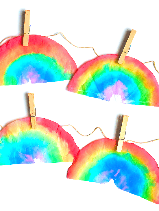 4 Rainbow dyed coffee filters cut into rainbow shape.