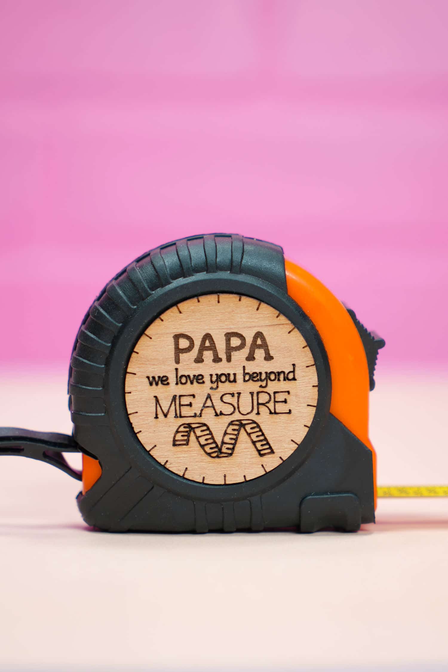 "Papa We Love You Beyond Measure" tape measure on purple background