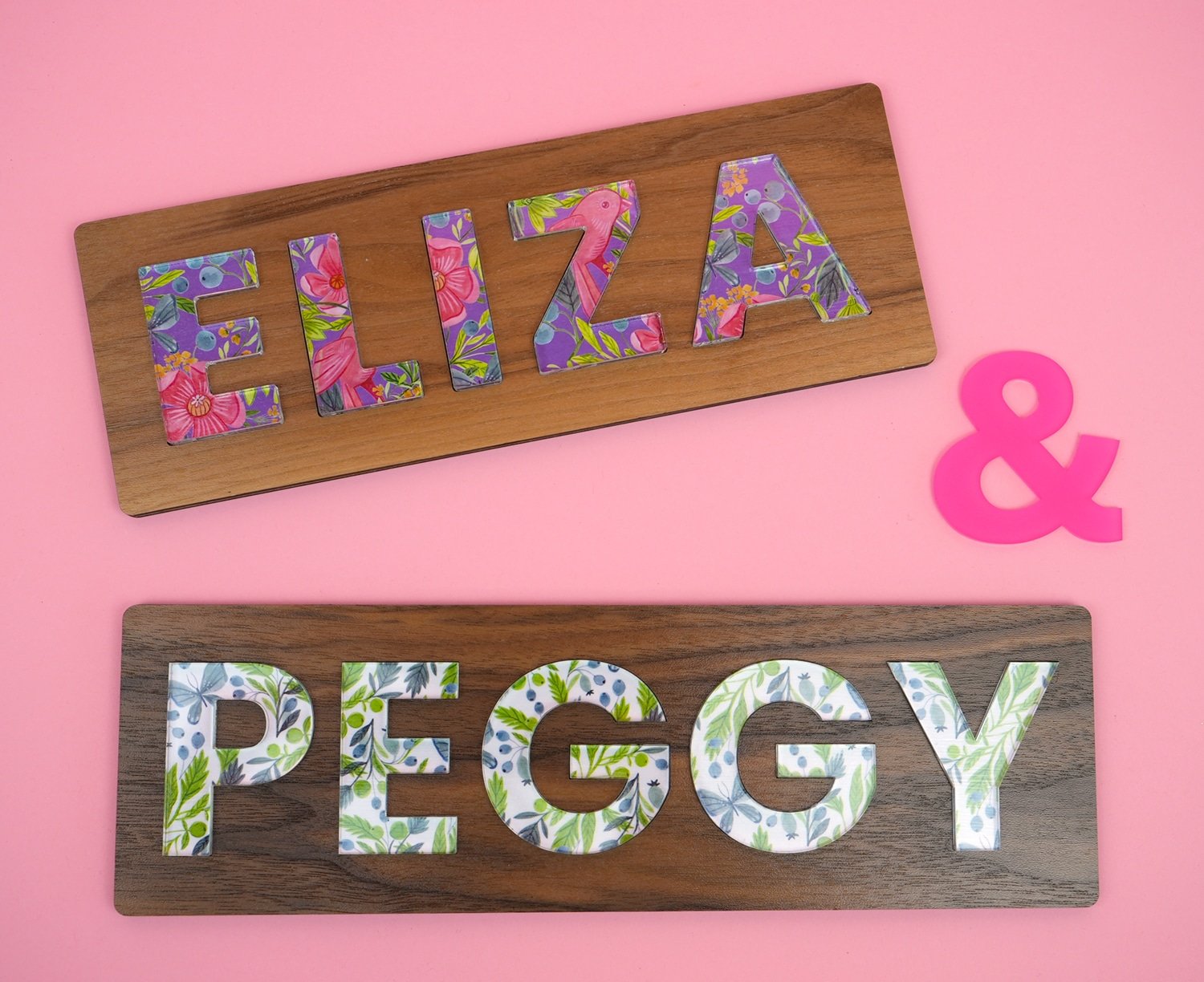 "ELIZA" and "PEGGY" custom DIY personalized name puzzles on a coral background
