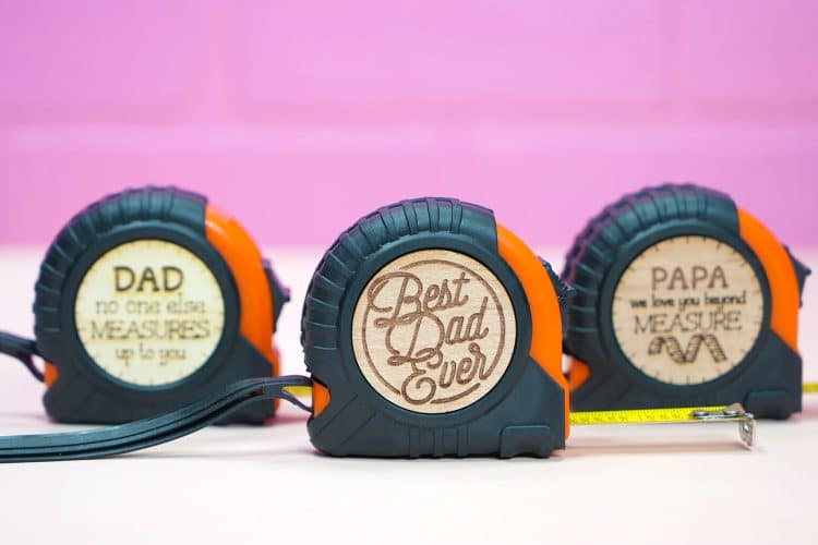 "Best Dad Ever" tape measure with wood sticker on purple background