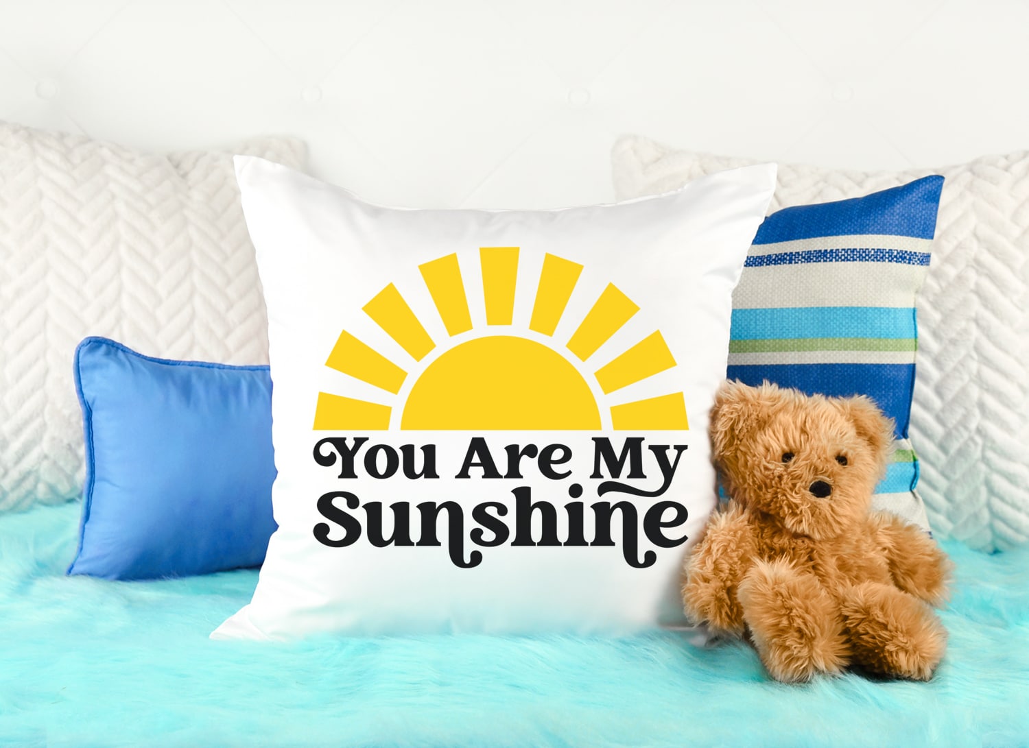 you are my sunshine svg file on white pillow with teddy bear