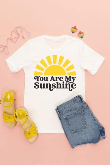 you are my sunshine svg file on white shirt styled with sandals, shorts