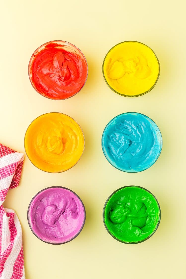 Divided and Colored Rainbow Donut Batter in glass bowls