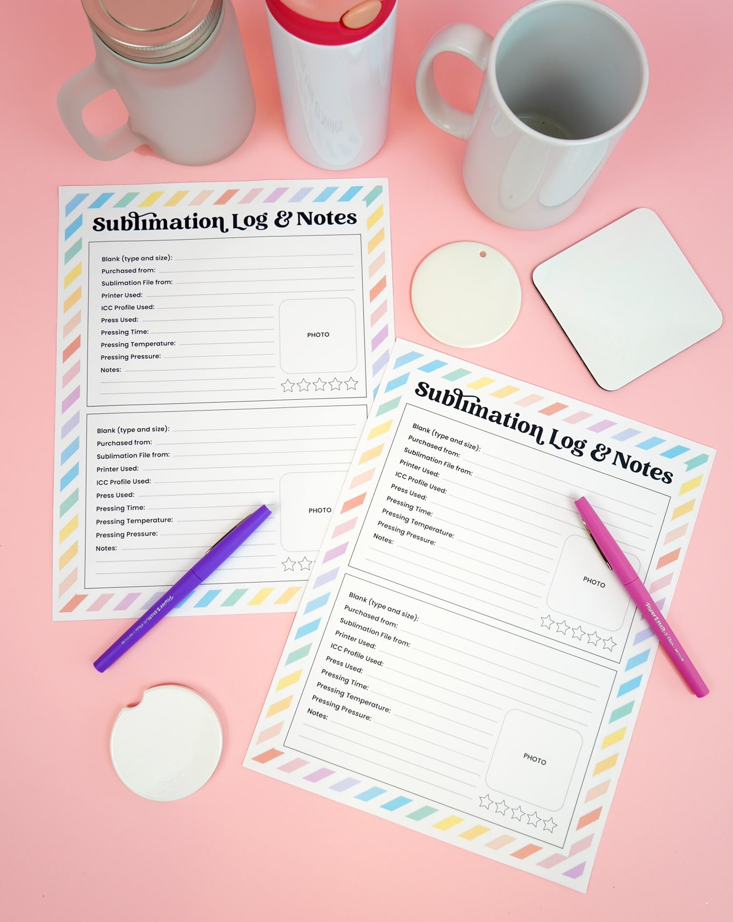 Two sublimation log and notes printables on a pink background with purple pens and assorted sublimation blanks