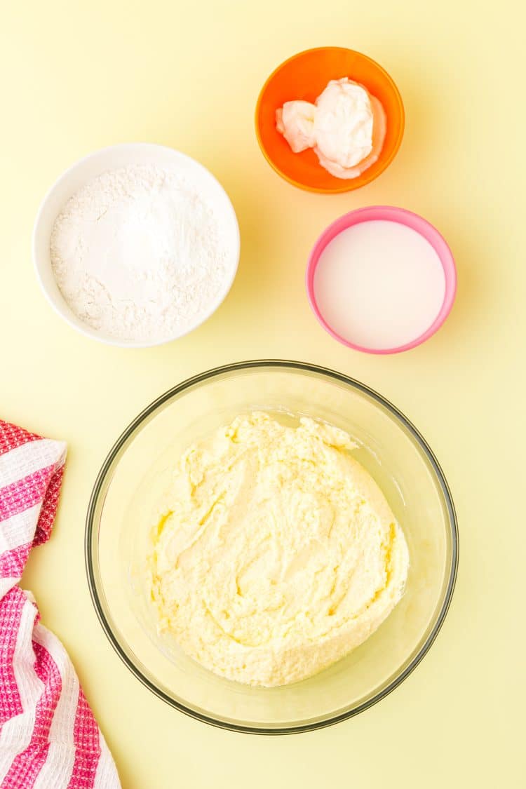 Rainbow Cupcakes - Wet Ingredients in a bowl on a yellow background