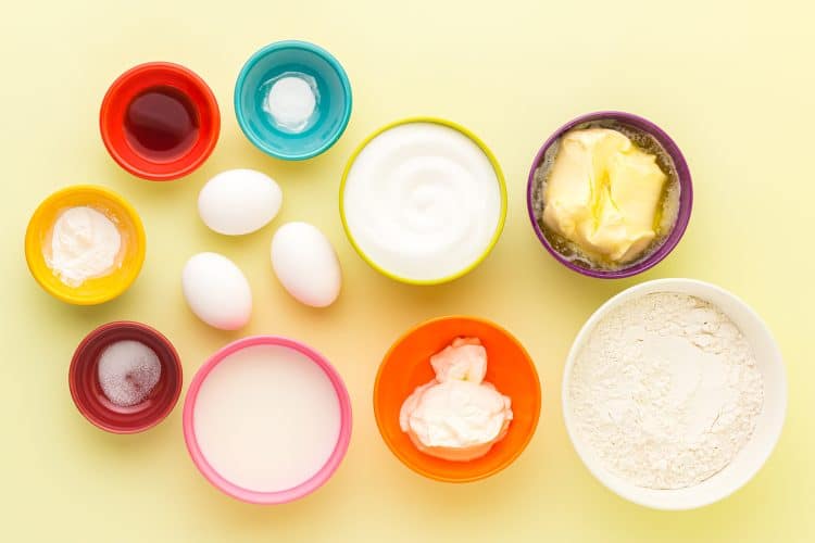 Rainbow Cupcake Ingredients on a yellow background