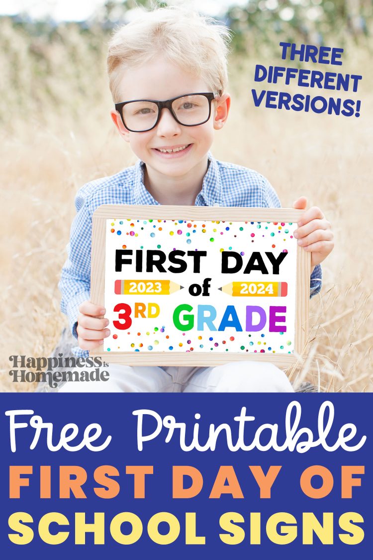 a young boy holding up a first day sign