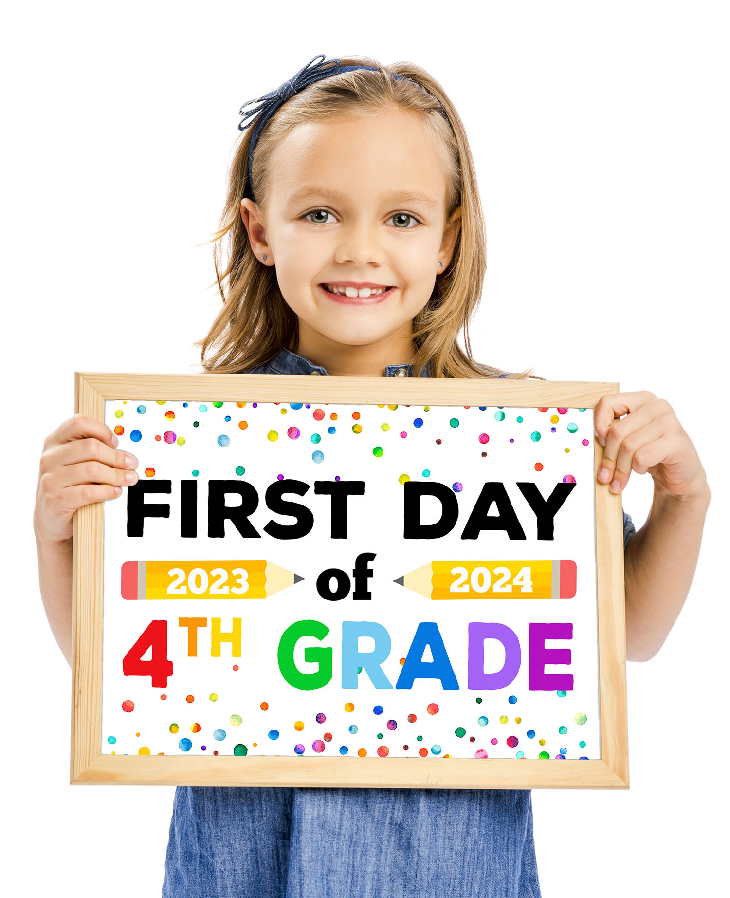 Cute white girl with short brown hair holding a First Day of 4th Grade sign