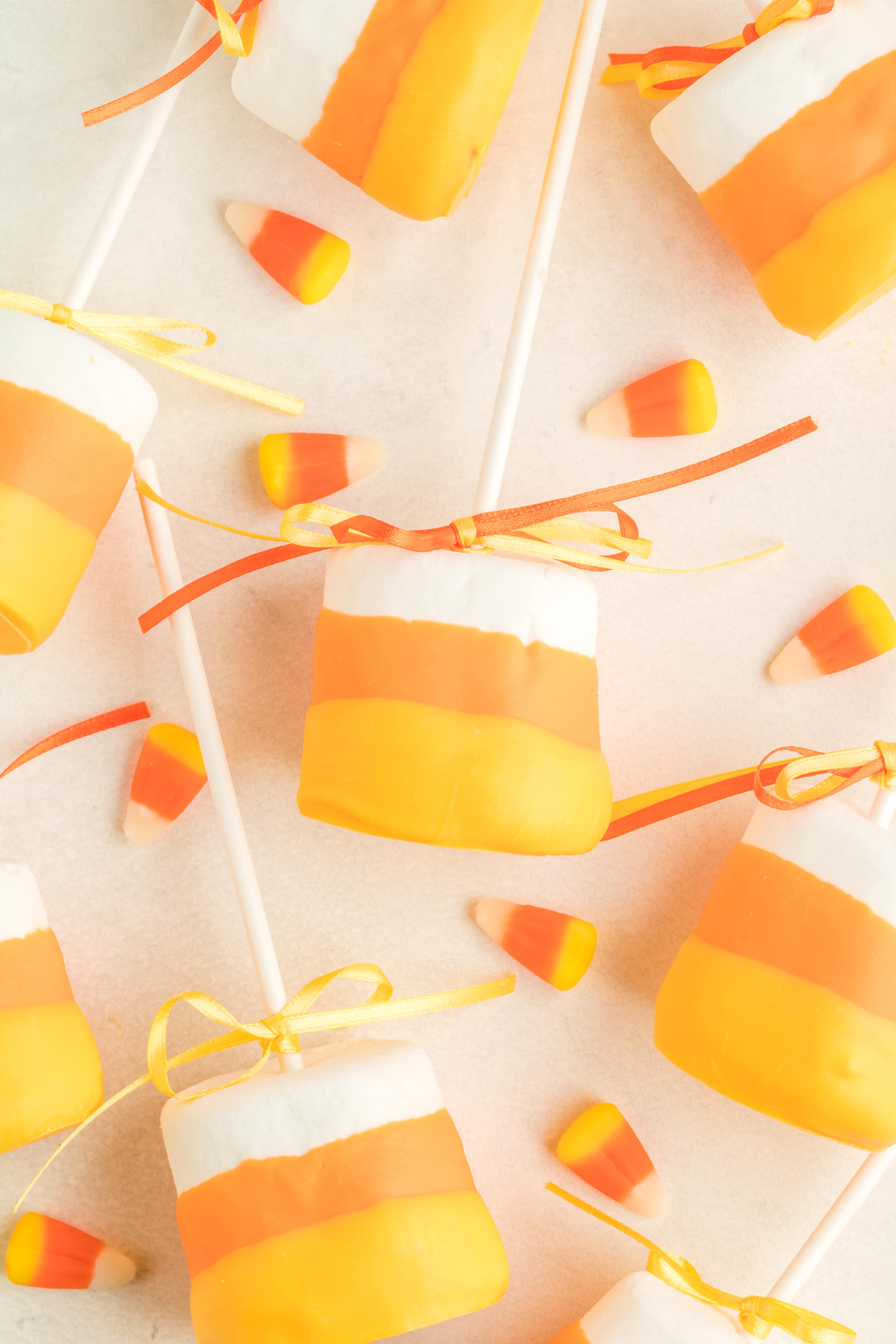 candy corn marshmallow pops with candy corn background