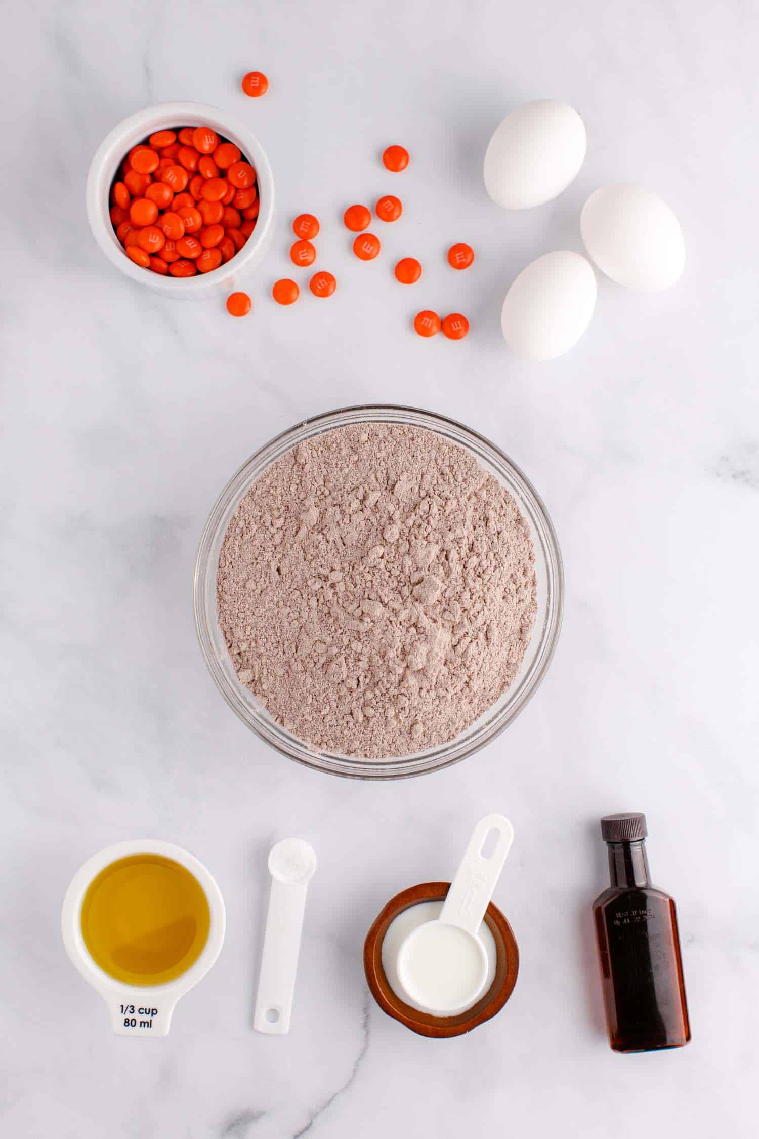 Supplies in a bowl to make Halloween Cake Mix Cookies.