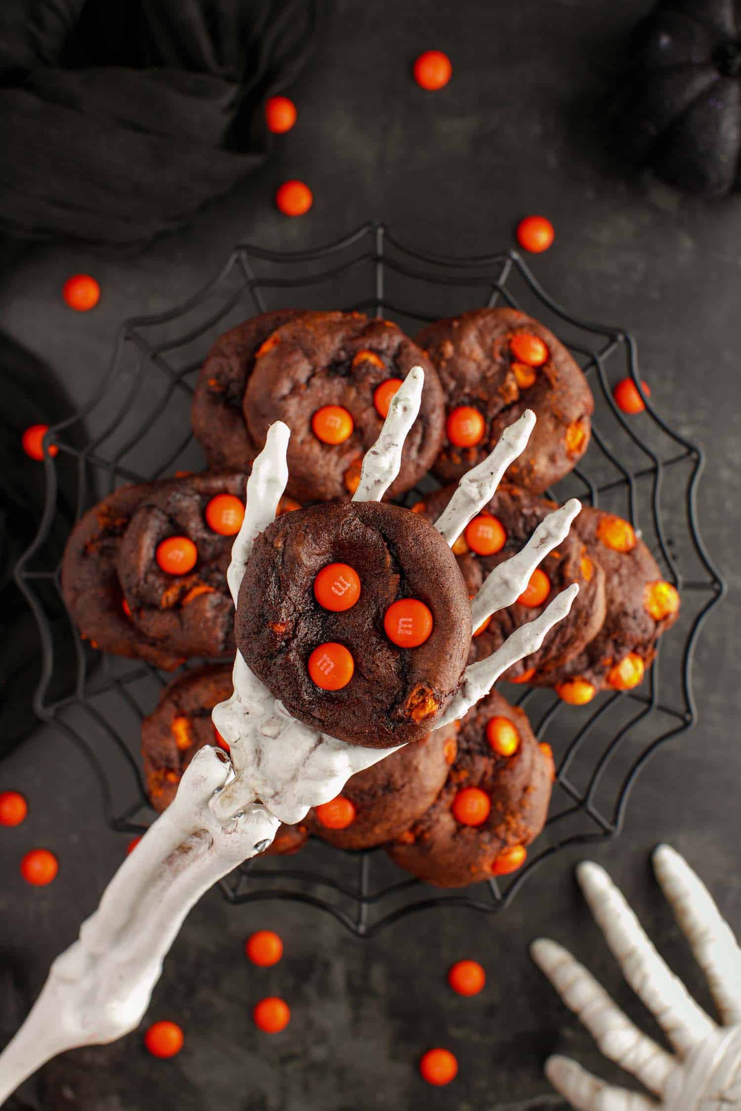 Halloween cake mix cookies in a skeleton prop hand.
