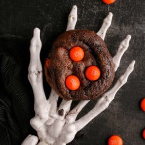 skeleton hand holding Halloween cake mix cookies