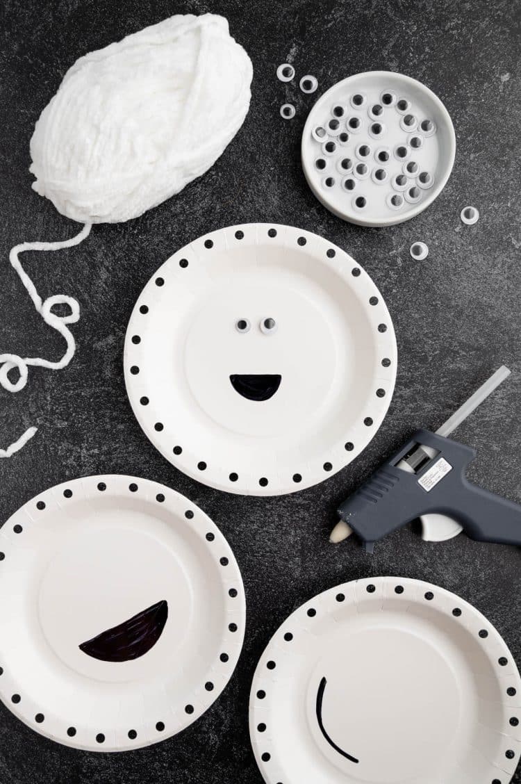 googly eyes glued to center of mummy paper plate craft