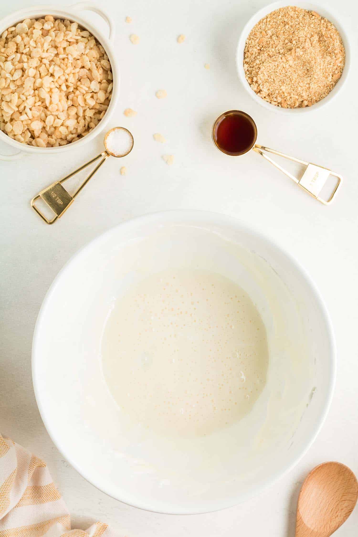 White Mixing Bowl with Ingredients Pictured to the side ready to be mixed for Pumpkin Pie Treat