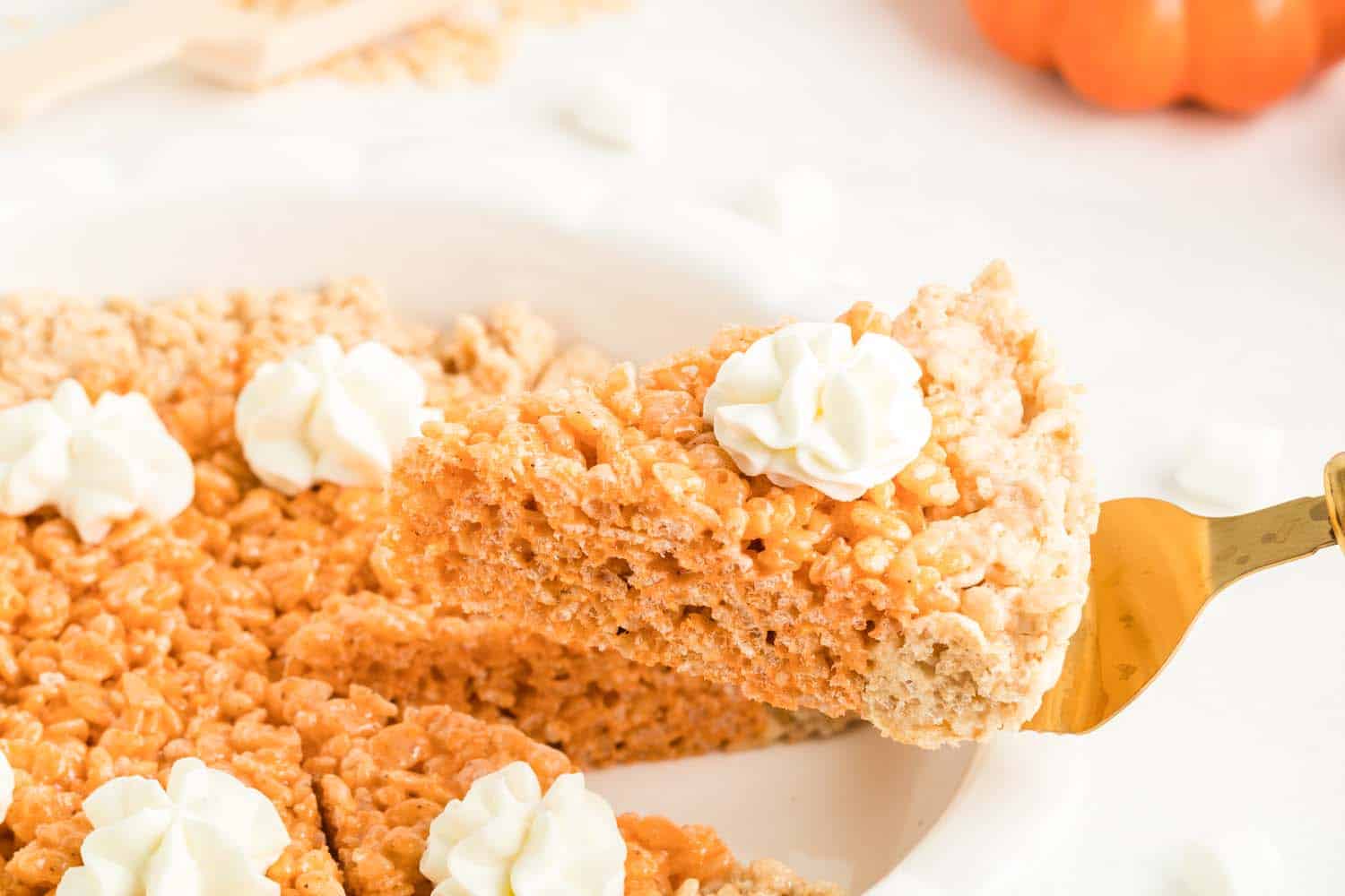 Slice of Pumpkin Pie Treat Lifted on Fork Zoomed, Showing Whipped Cream atop