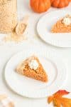 Pumpkin Pie Thanksgiving Krispie Treat with Whipped Cream on Plate with Fall Tabletop Background