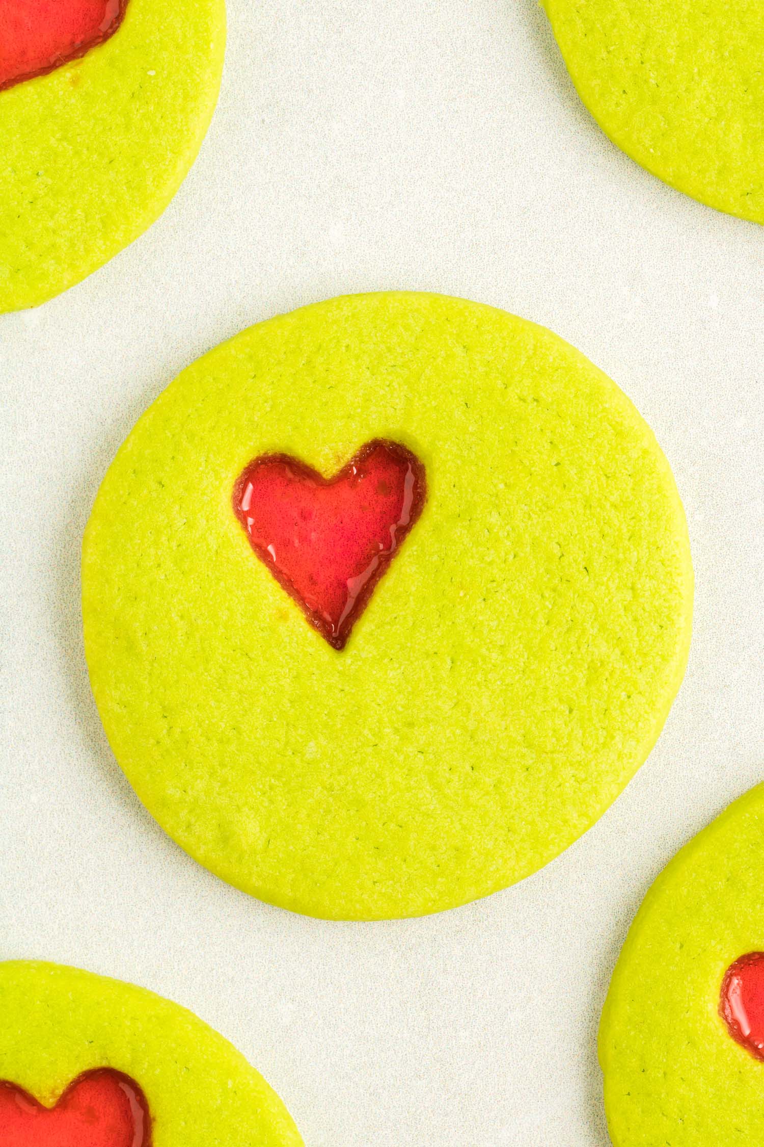 Single round Christmas cookie with red candy heart