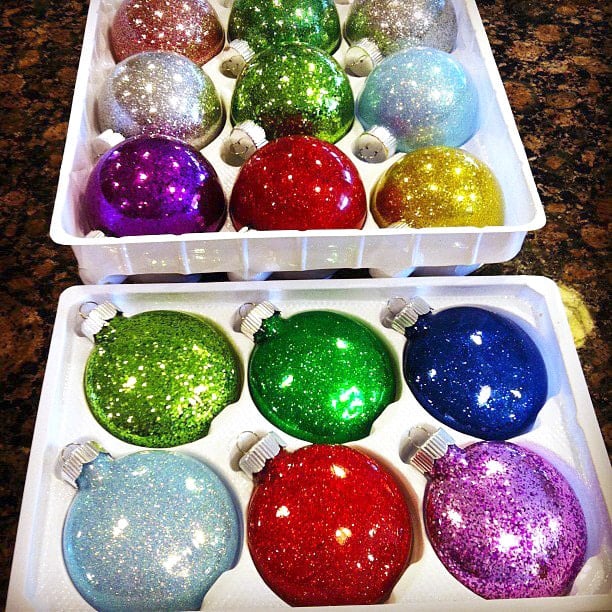 Multicolored glitter Christmas ornaments in plastic trays