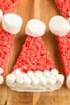Large Santa hat dessert up close on wooden board