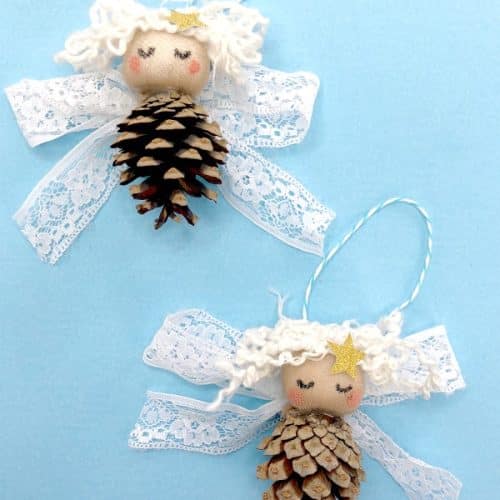 Pine cone angel ornaments on blue background