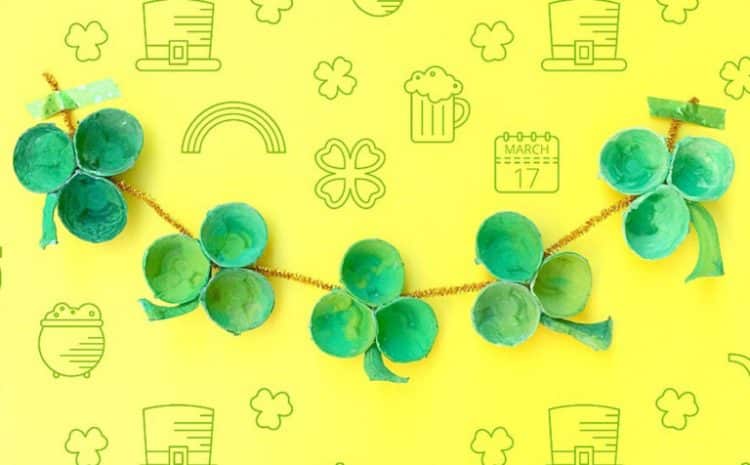 shamrock garland made from painted egg carton cups on yellow background