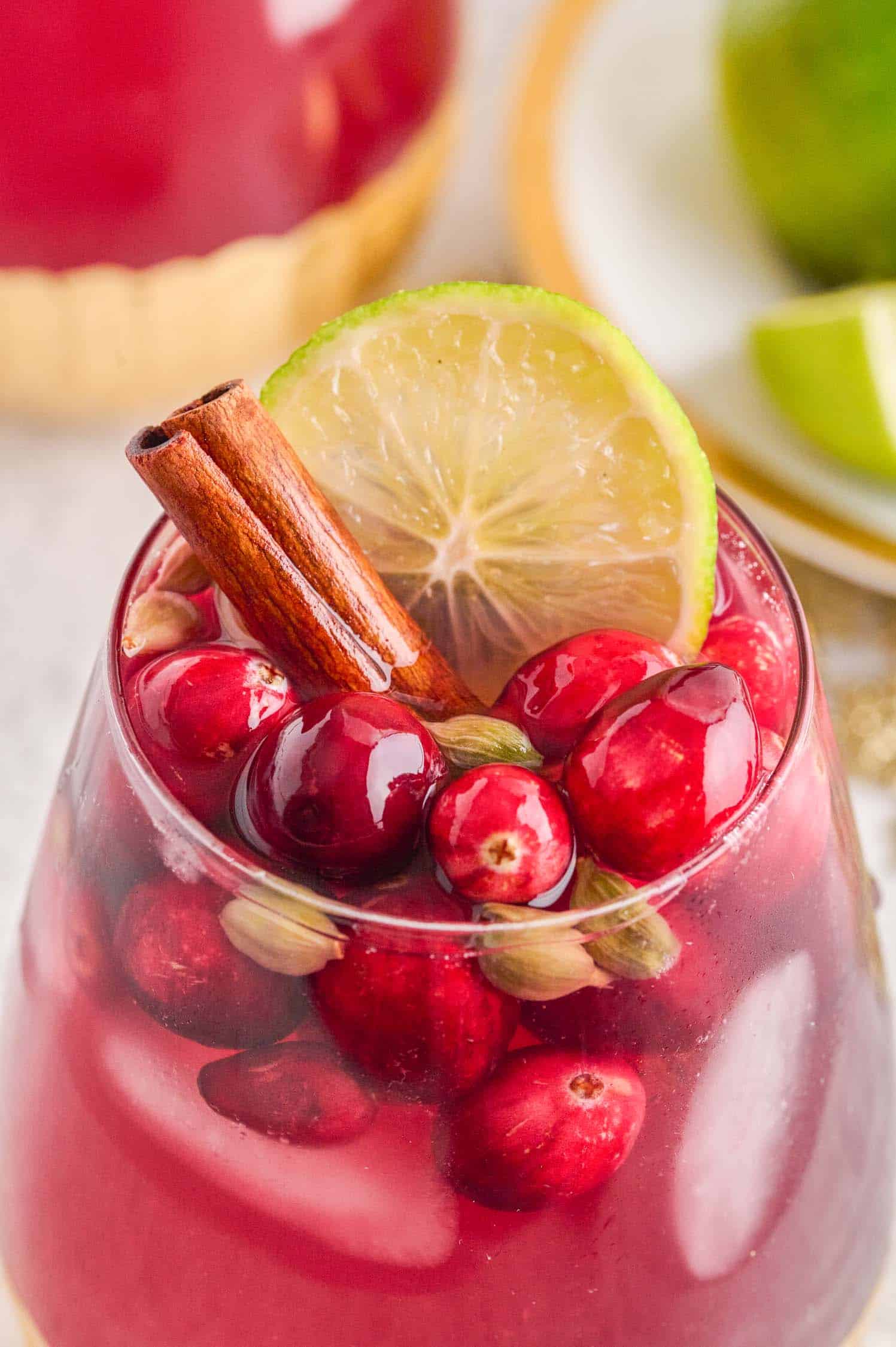 Detail closeup shot of a glass of Spiced Cranberry Wine Spritzer