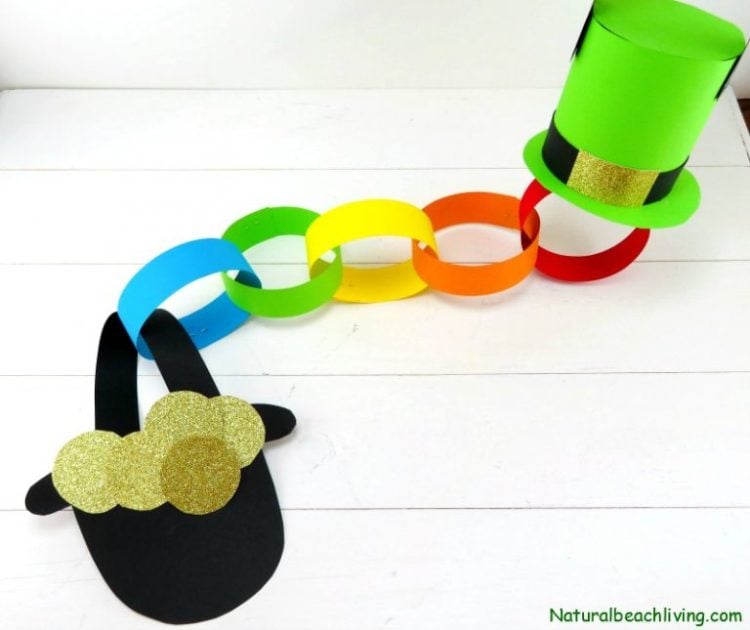 rainbow paper chain with a leprechaun hat on one end and a pot of gold on the other end