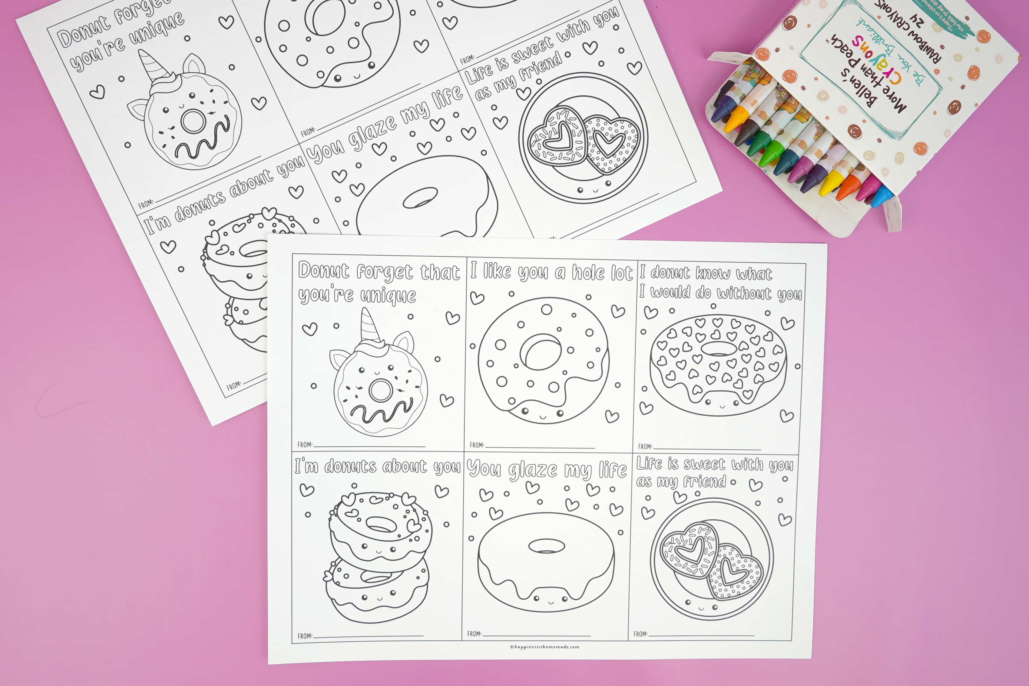 full sheet of paper with printable donut valentine cards and crayons