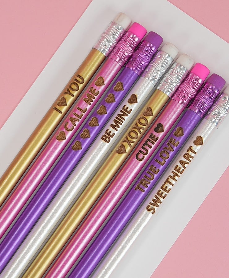 girly colored pencils engraved with valentines sayings and hearts