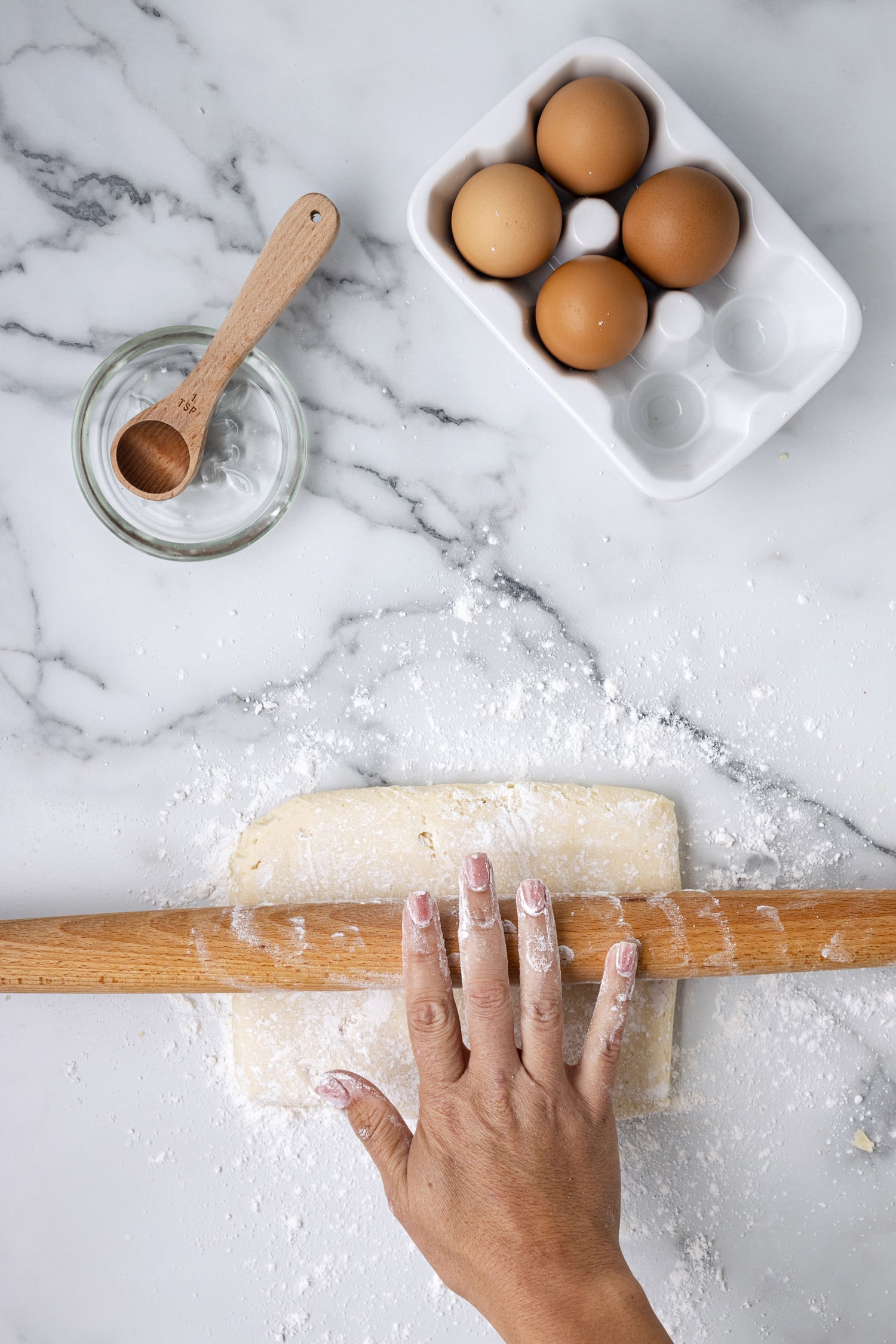 Sugar cookie dough rolled out in flour