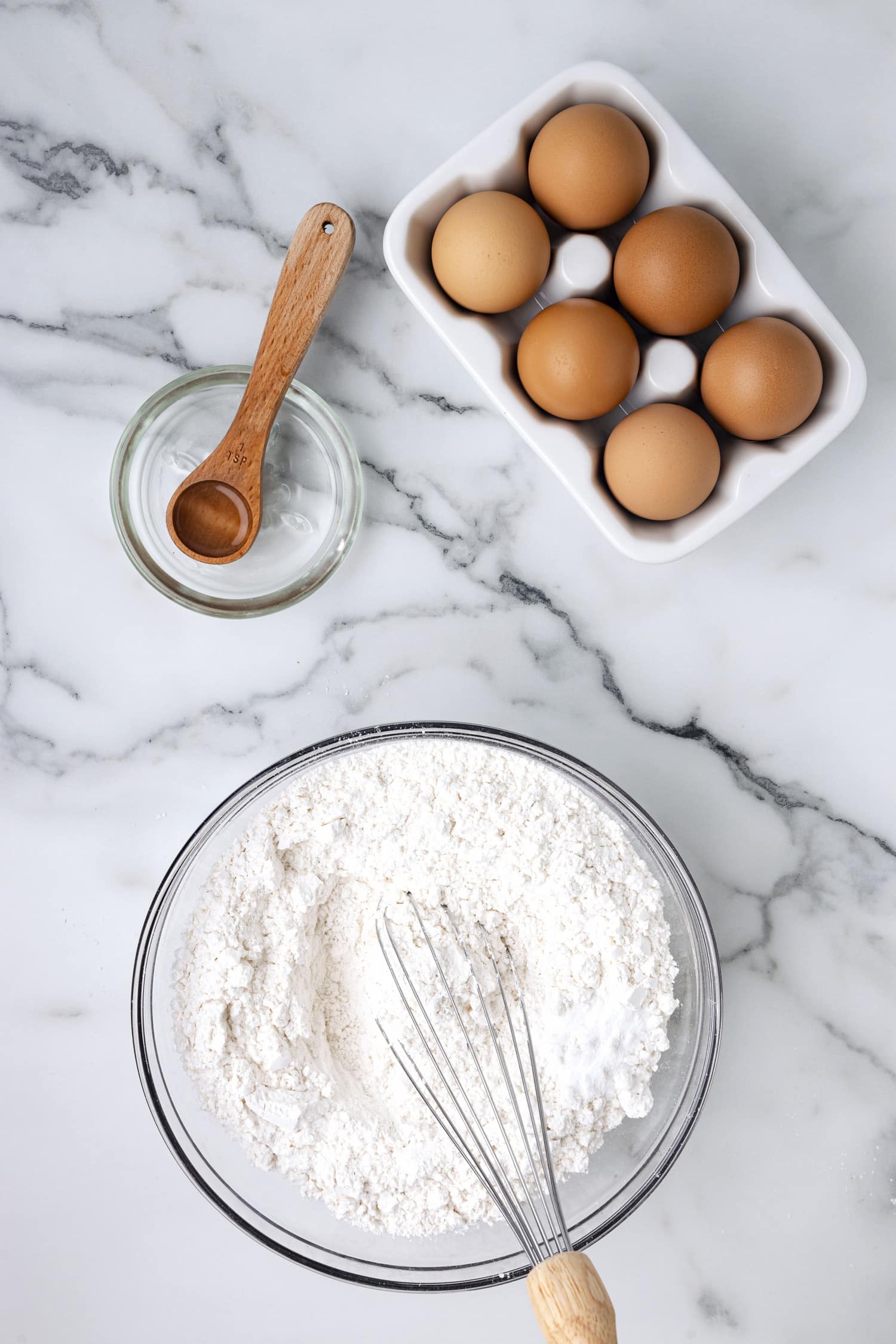 Whisking bowl of sugar cookie ingredients