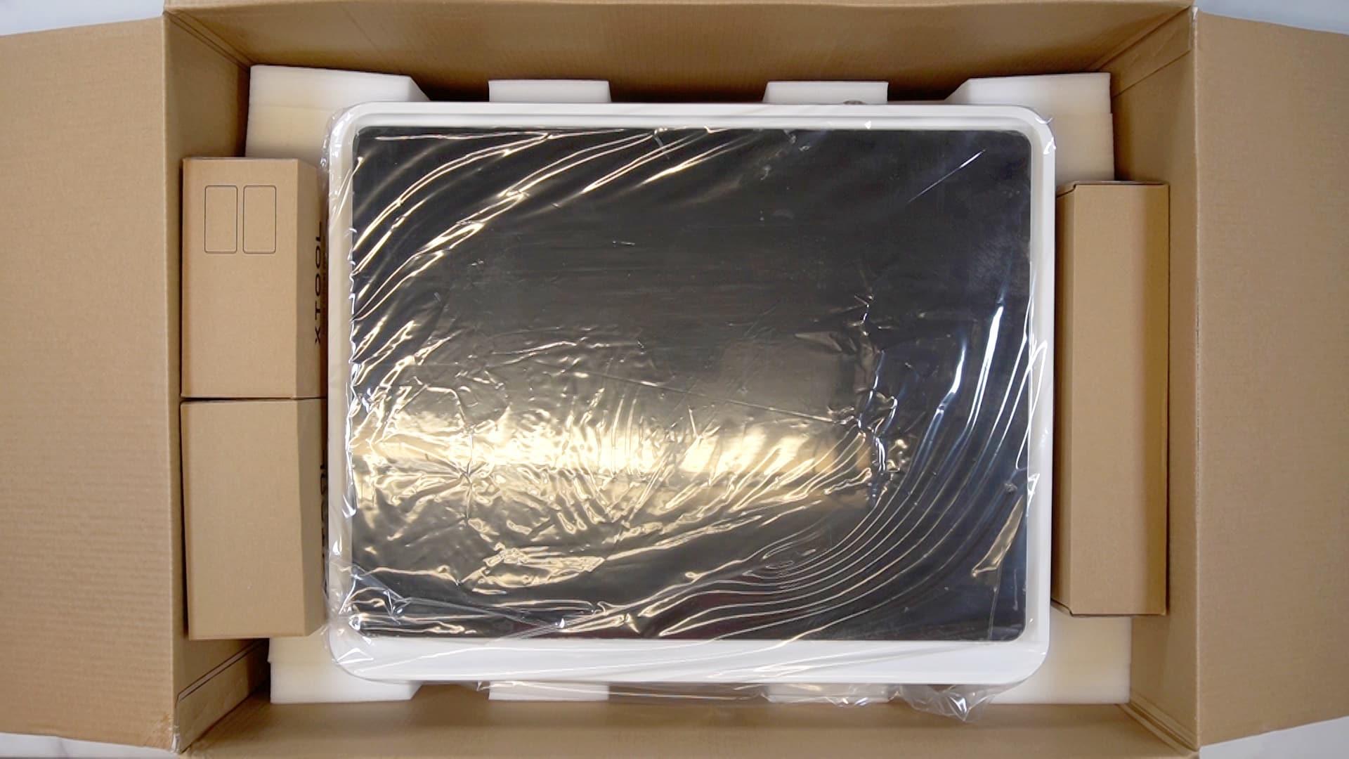 Overhead view of xTool M1 laser in packaging box