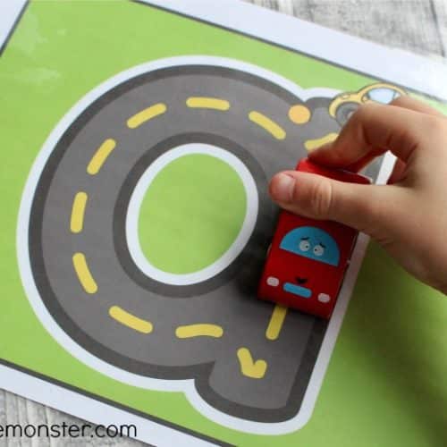 Alphabet roads craft with kid driving toy car over road