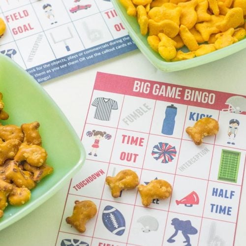 Printable football bingo cards laid on table with goldfish snacks