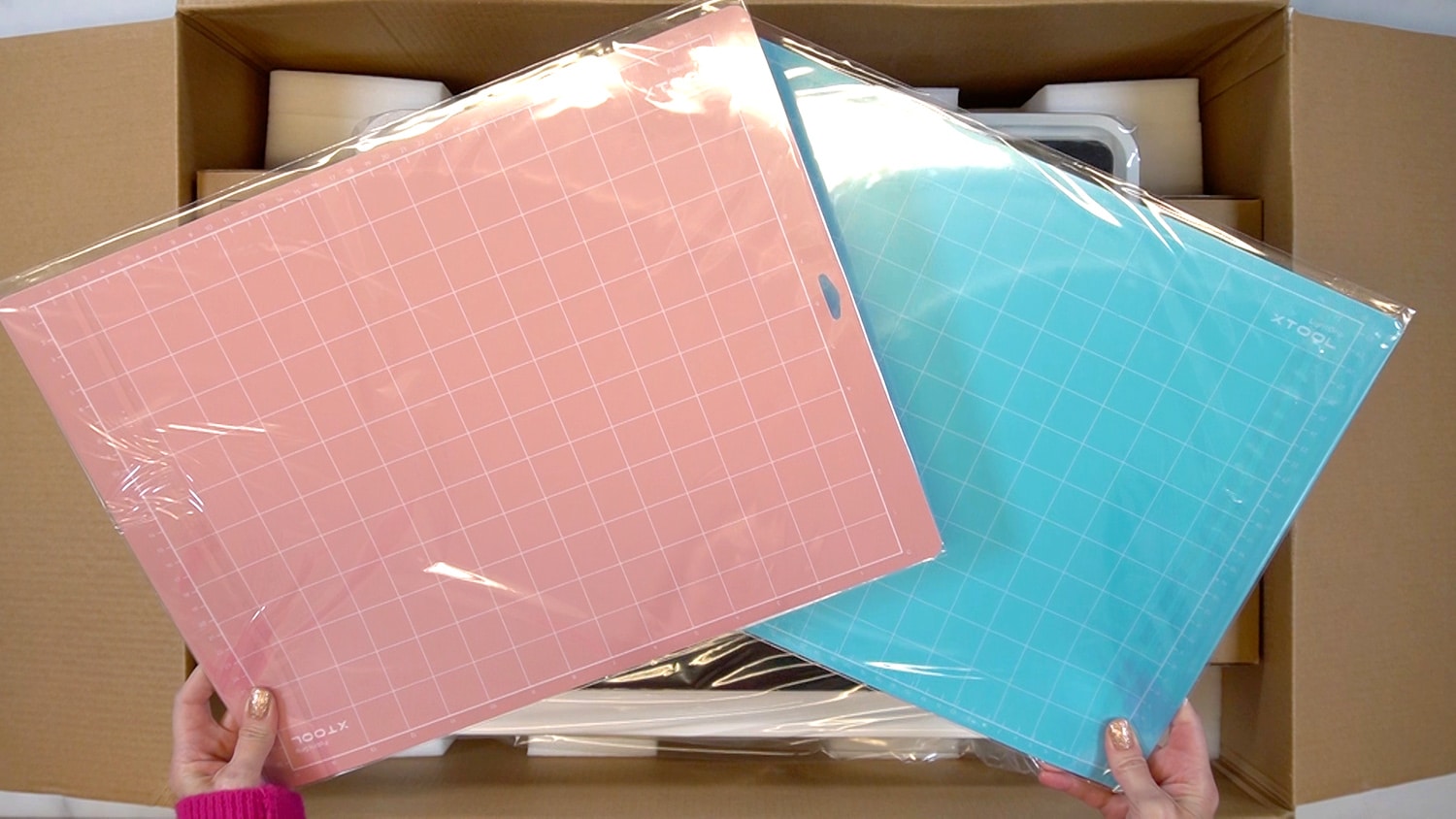 cutting mats from xtool m1 box in pink and blue