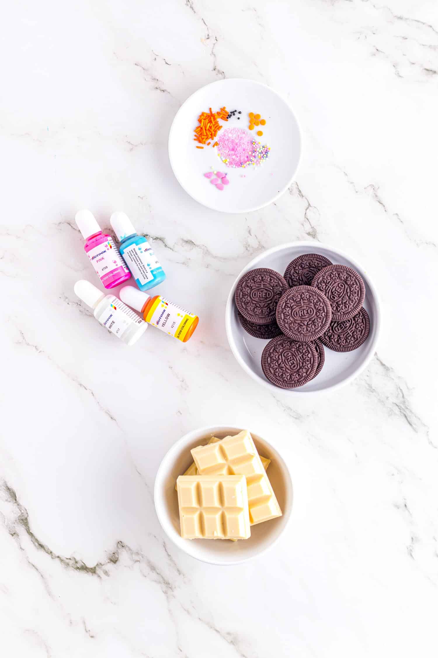 Individual ingredients for Oreo Easter Cookie recipe on granite table