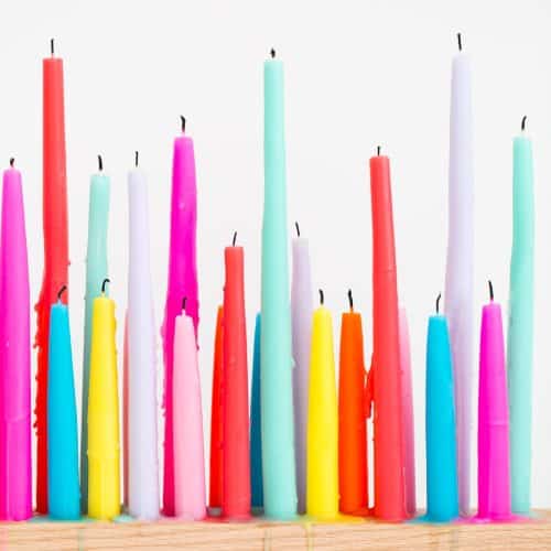 Rainbow candle holderd in a line